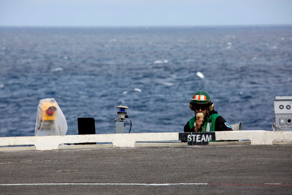 Abraham Lincoln Sailor stands watch on the flight deck