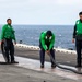 Abraham Lincoln Sailors secure a catapult