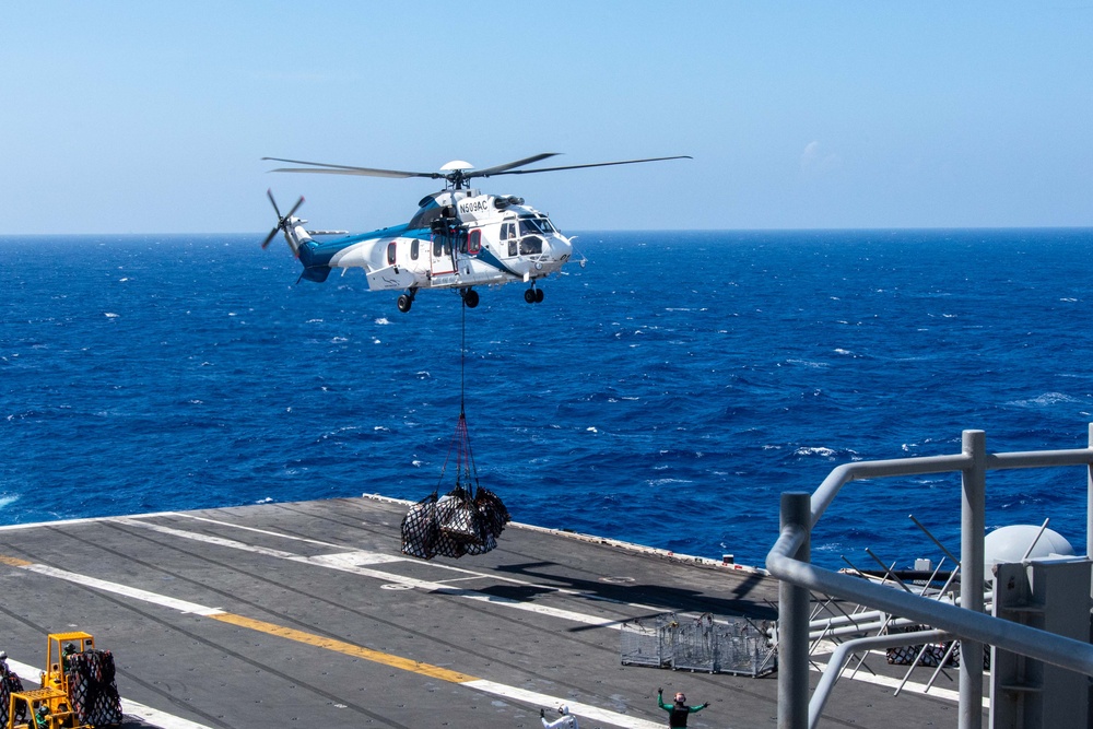 USS Ronald Reagan (CVN 76) conducts replenishment-at-sea with USNS Carl Brashear (T-AKE 7)