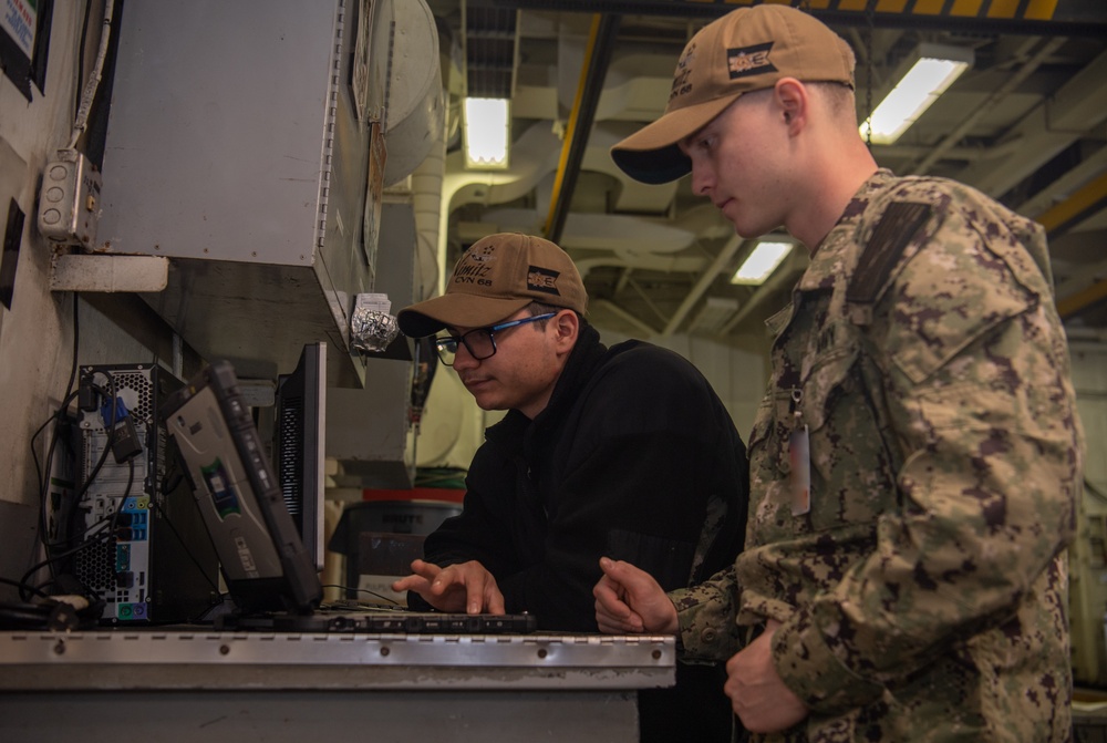 U.S. Navy Sailors Review Maintenance