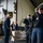 U.S. Navy Sailors Move Equipment Into Hangar Bay