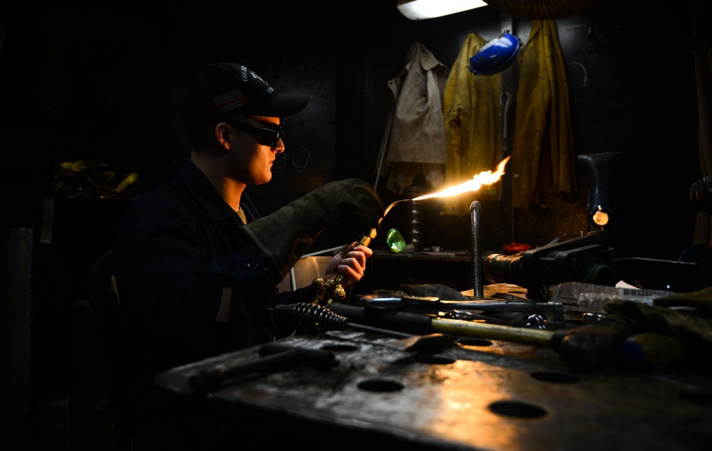 U.S. Navy Sailor Braises Pipe Together