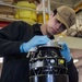 U.S. Navy  Sailor Inspects Engine Starter