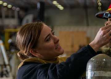 U.S. Navy Sailor Dons Firefighting Ensemble