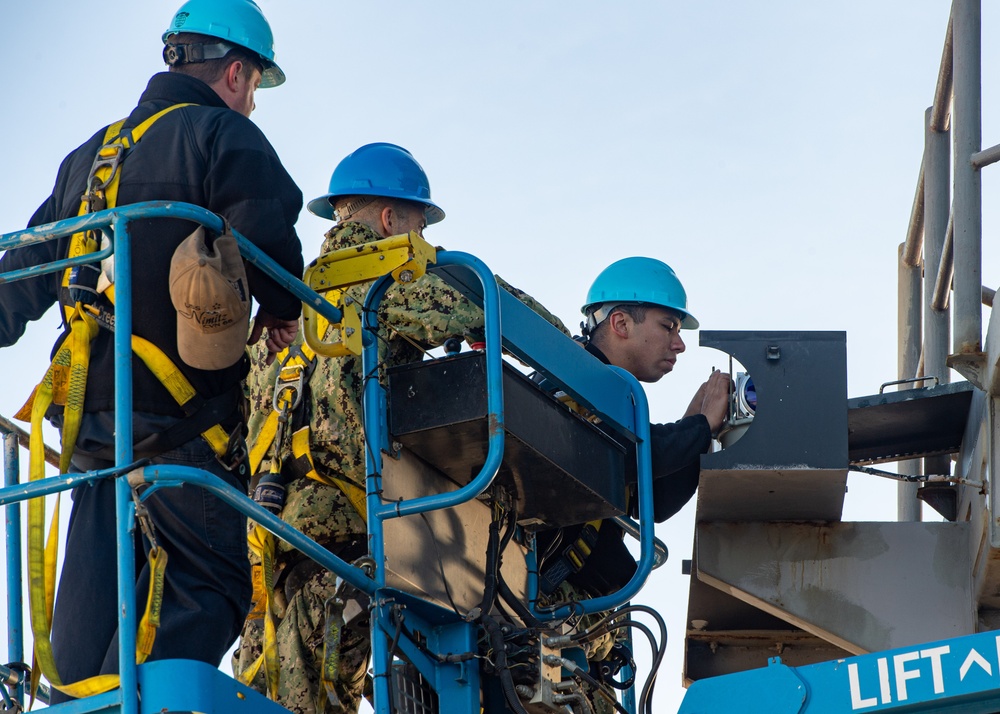 U.S. Navy Sailors Replace Light