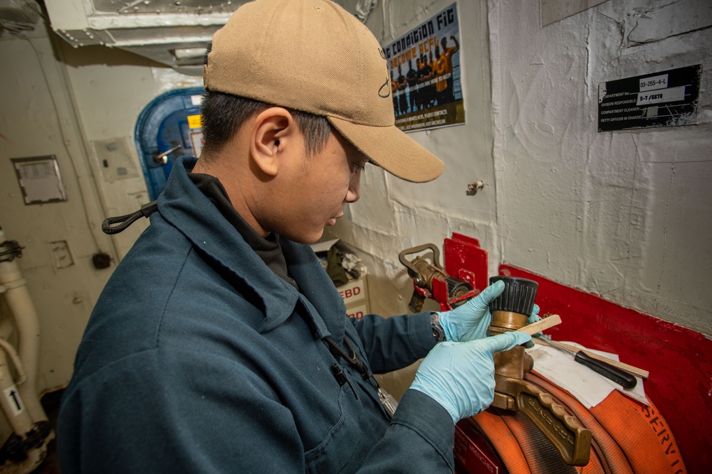 U.S. Navy Sailor Does Maintenance