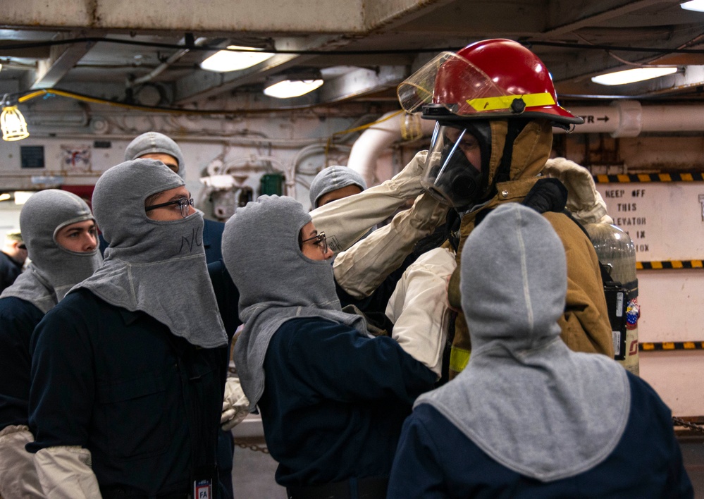 U.S. Navy Sailors Don Firefighting Ensemble