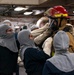 U.S. Navy Sailors Don Firefighting Ensemble