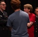 Musician 1st Class Benjamin Ford speaks with students at Troy University