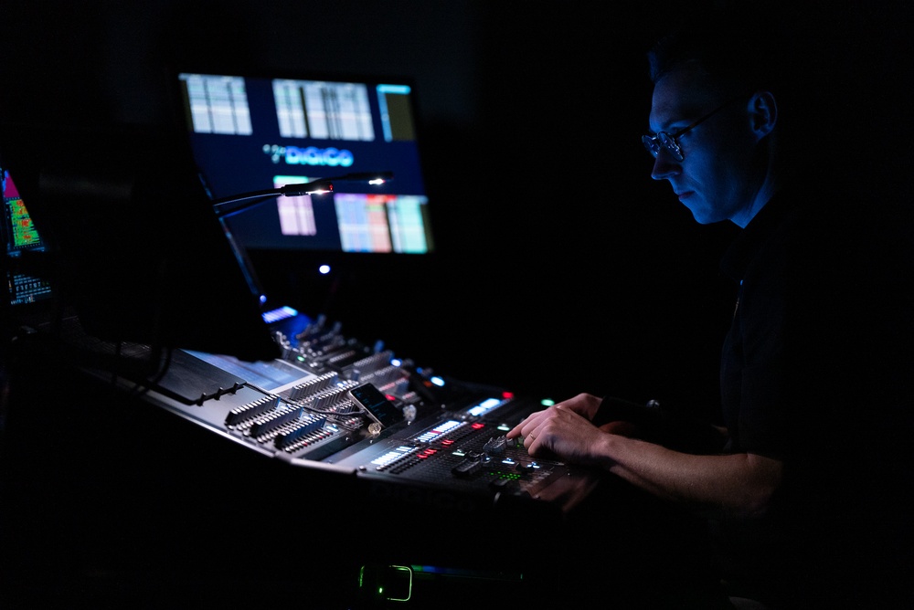 Musician 1st Class David Angell masterfully monitors the sound levels at Pace Assembly of God Church