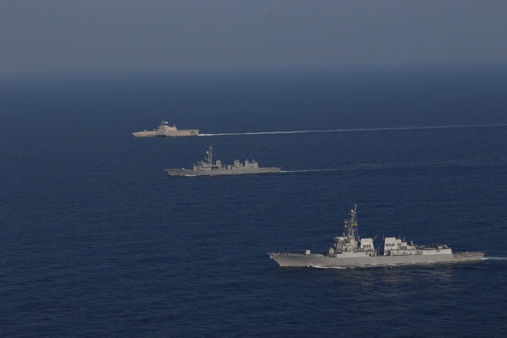 USS Gabrielle Giffords steams in formation with USS Dewey, JS Akebono