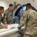 Soldiers inspect CT machine