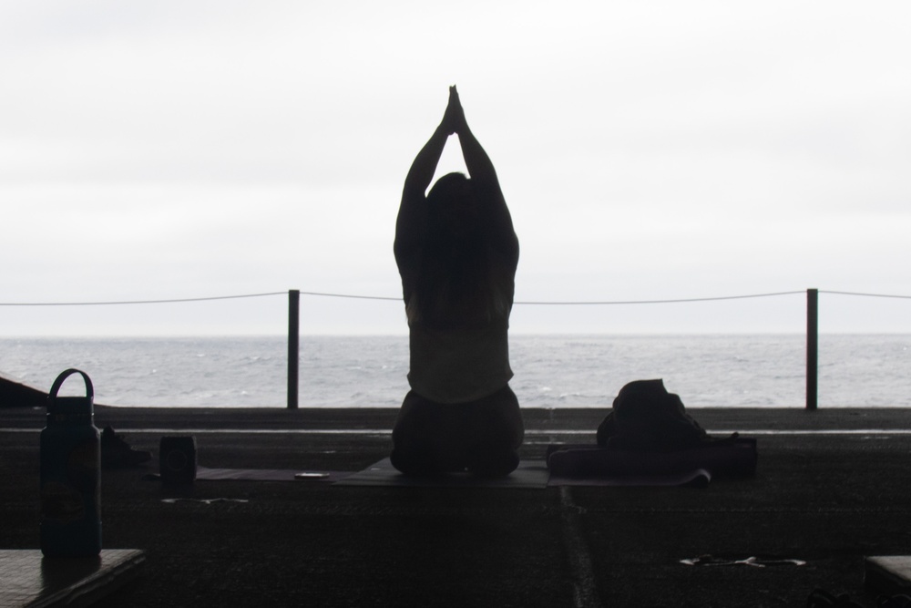 Yoga is taught on board USS Abraham Lincoln