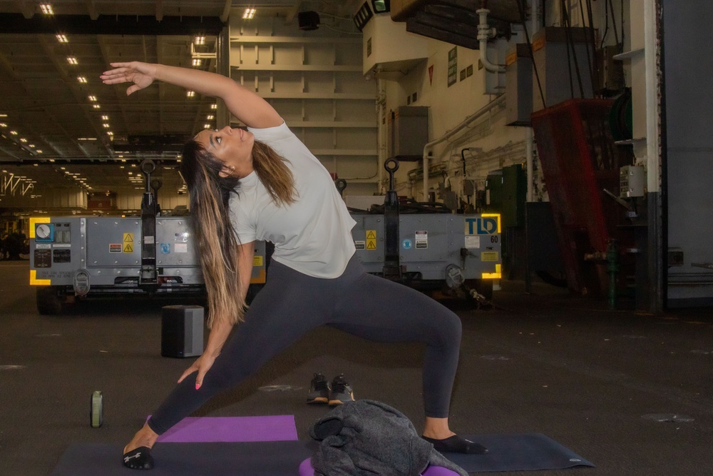 Yoga is taught on board USS Abraham Lincoln