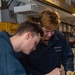 USS Ronald Reagan (CVN 76) Sailors inspect aviation electronic equipment