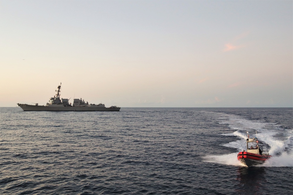 U.S. Coast Guard Cutter Vigilant (WMEC-617) conducts a joint operation with the USS Farragut (DDG-99)