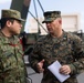 U.S. Marines and JGSDF Members hold capabilities brief