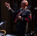 Chief Musician Shawn Purcell conducts the band at Saenger Theater