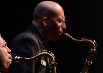 Musicians 1st Class Justin Mendez and Frank Silva have a dueling sax battle at Saenger Theater