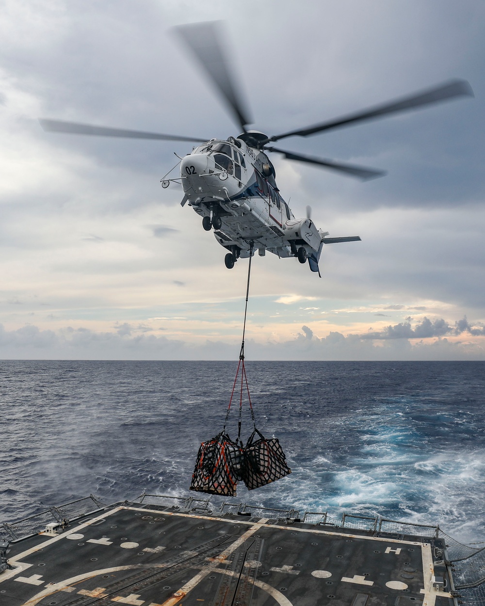 USS Shoup conducts replenishment-at-sea with USNS Tippecanoe and USNS Carl Brashear