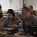 U.S. Army Capt. Michaela Farris and Capt. Michael MacGovern speak during 15th EN BN CPX