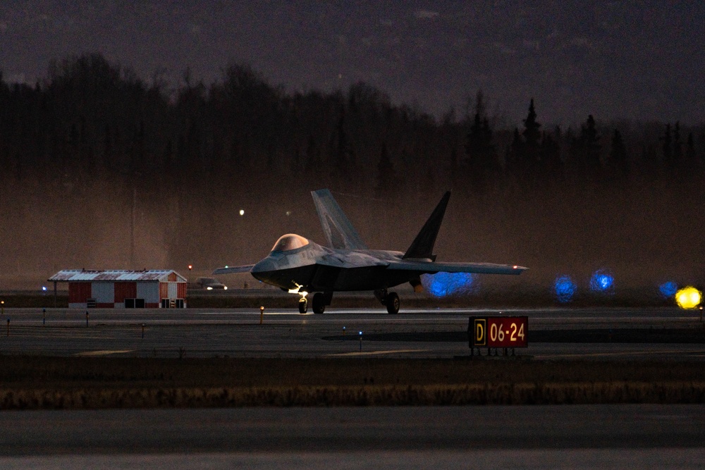 F-22 Raptors morning takeoff