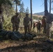 U.S. Marines, Sailors, and Forest Service personnel work to recover a downed U.S. Navy MH-60S Seahawk