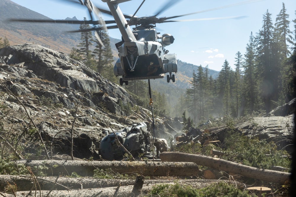 U.S. Marines, Sailors, and Forest Service personnel recover a downed U.S. Navy MH-60S Seahawk