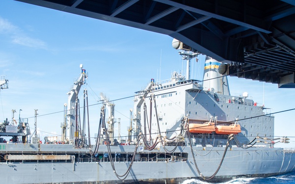 USS Ronald Reagan (CVN 76) conducts fueling-at-sea with USNS Yukon (T-AO 202)