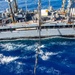 USS Ronald Reagan (CVN 76) conducts fueling-at-sea with USNS Yukon (T-AO 202)