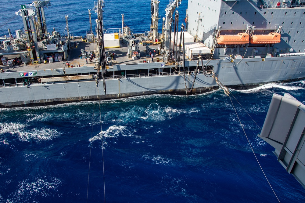 USS Ronald Reagan (CVN 76) conducts fueling-at-sea with USNS Yukon (T-AO 202)