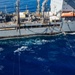 USS Ronald Reagan (CVN 76) conducts fueling-at-sea with USNS Yukon (T-AO 202)