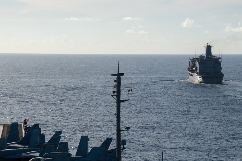 USS Ronald Reagan (CVN 76) conducts fueling-at-sea with USNS Yukon (T-AO 202)