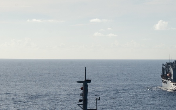 USS Ronald Reagan (CVN 76) conducts fueling-at-sea with USNS Yukon (T-AO 202)