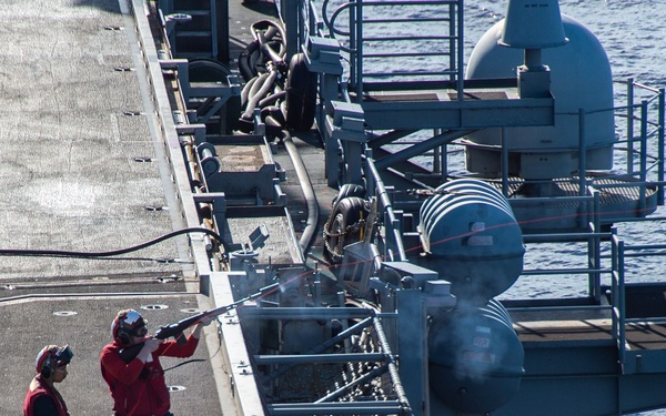 USS Ronald Reagan (CVN 76) conducts fueling-at-sea with USNS Yukon (T-AO 202)