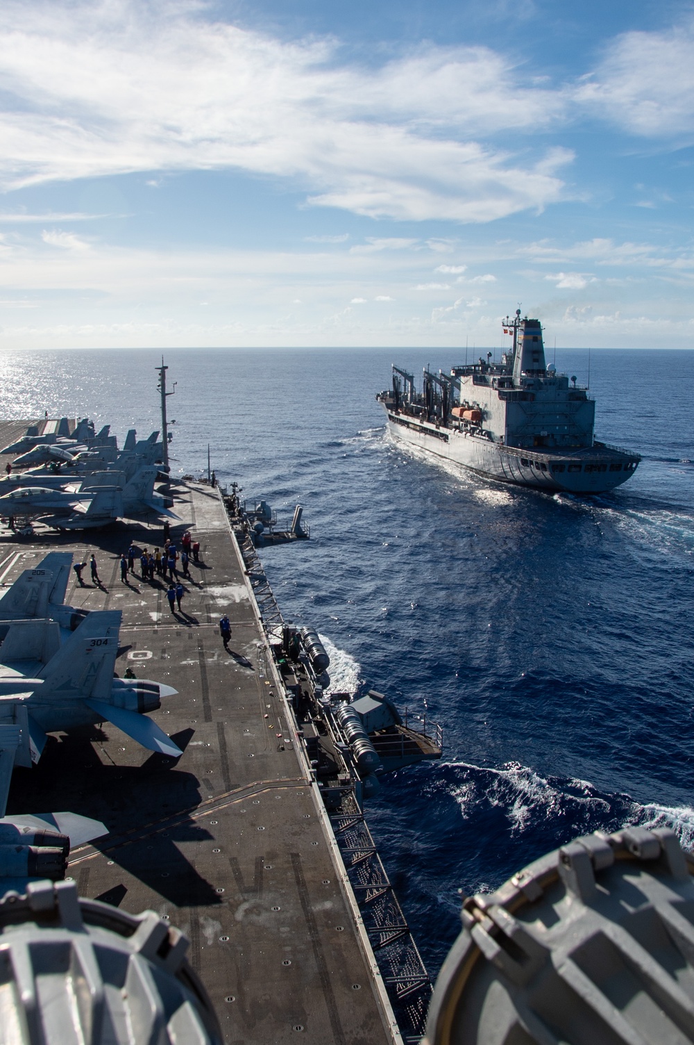 USS Ronald Reagan (CVN 76) conducts fueling-at-sea with USNS Yukon (T-AO 202)