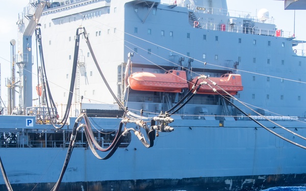 USS Ronald Reagan (CVN 76) conducts fueling-at-sea with USNS Yukon (T-AO 202)