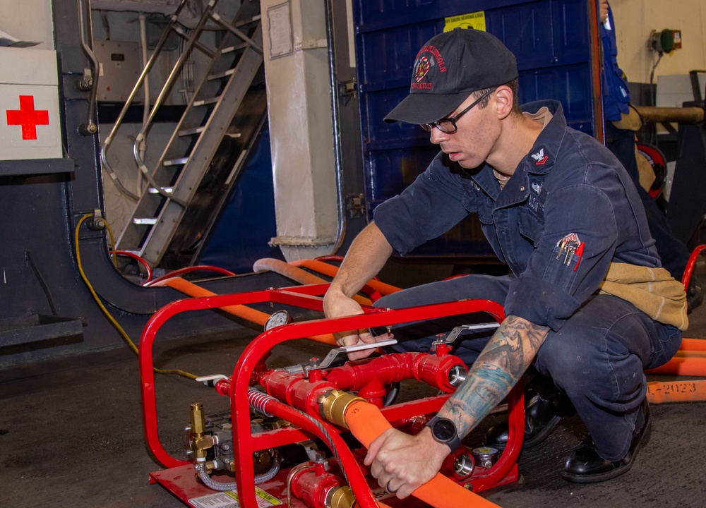 Abraham Lincoln conducts firemain hose maintenance