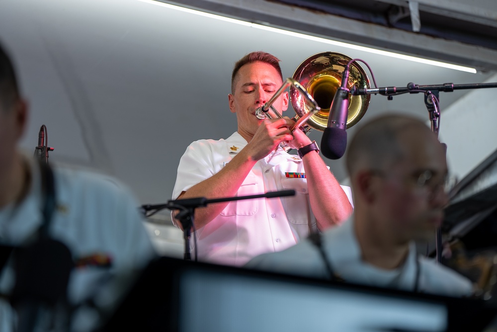 Musician 1st Class David Hagee performs a Bass Trombone Solo at the Historic Thomas Center Gardens