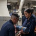 Sailors aboard USS Shoup conduct ammunition movement