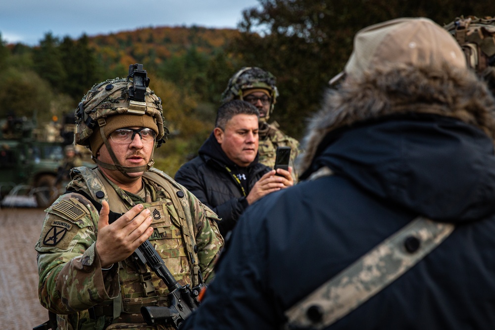 101st Airborne Soldier Interacts with Simulated Displaced Persons