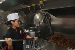 Culinary Specialists Prepare Lunch for the Crew Aboard the Arleigh Burke-class guided-missile destroyer USS Rafael Peralta (DDG 115) in the South China Sea