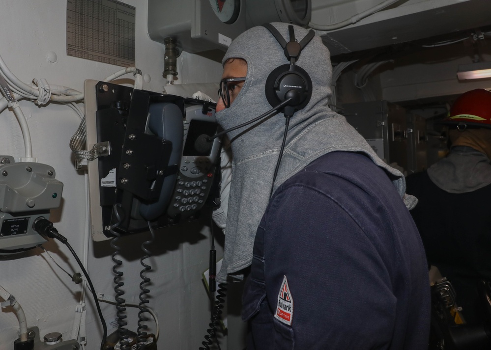 Sailors aboard the USS Rafael Peralta (DDG 115) conduct a general quarter drill in the South China Sea