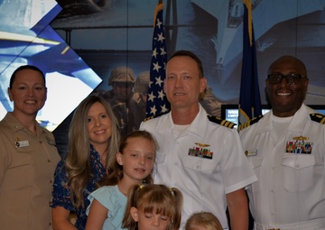 CDR Martin with his family and the Command Officer of NHC Charleston