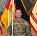 U.S. Army 1st Sgt.  Richard Telck stands at attention with Unit Colors