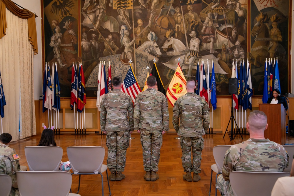Soldiers from HHC USAG Stuttgart stand at attention