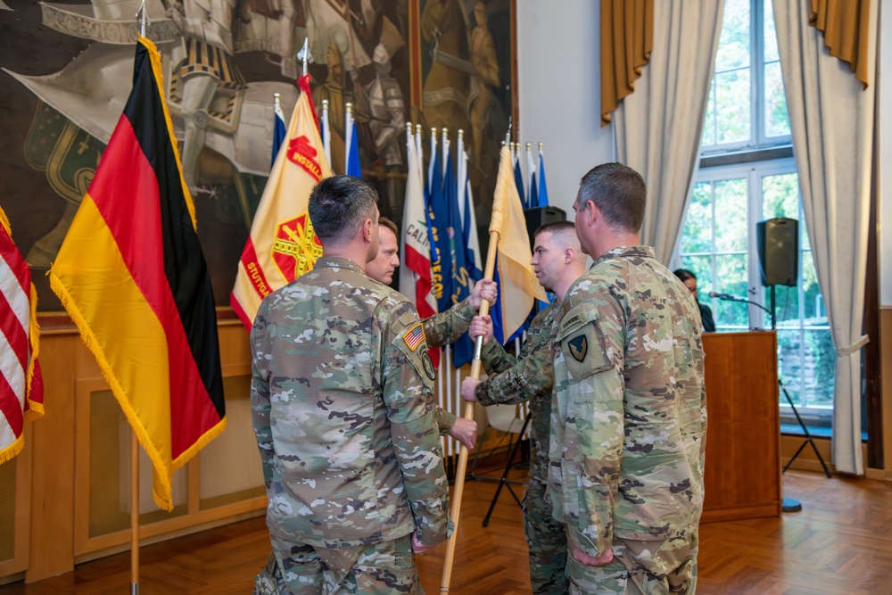 U.S. Army 1st Sgt. Richard Telck Passes the Unit Colors to outgoing HHC commander Capt. Travis Green