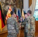 U.S. Army 1st Sgt. Richard Telck Passes the Unit Colors to outgoing HHC commander Capt. Travis Green