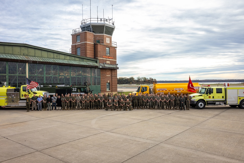 U.S. Marines with Marine Corps Air Facility take a group photo after a post and relief ceremony