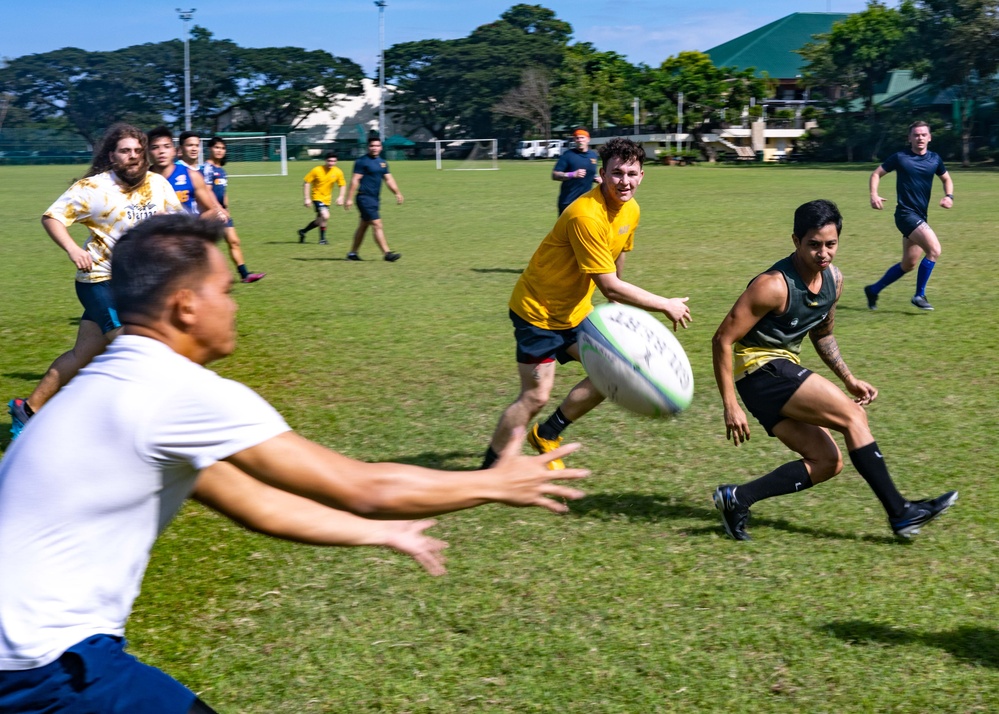 Ronald Reagan Carrier Strike Group Sailors play rugby in the community during port visit to Manila